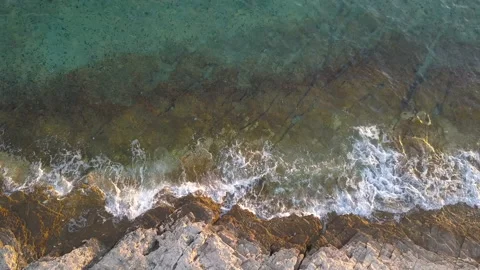 Aerial drone view of sea waves and rocks on the beach. 動画素材 209979563