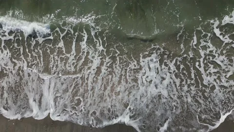 Aerial drone view of sea waves crashing on the sandy shore, Japan Stock Footage 223677682