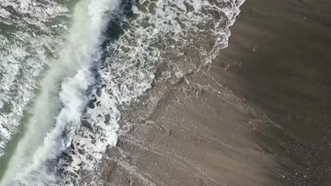 Aerial drone view of sea waves crashing on the sandy shore, Japan Stock Footage 223677901