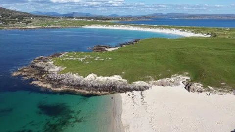 Aerial drone view of a secluded sandy cove near Dog’s Bay, Ireland. Stock Footage 343939373