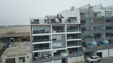 Aerial drone view of several beach houses with swimming pool in Punta Hermosa, L 库存影片 195992923