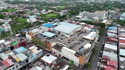 Aerial Drone View of Shopping Complex and Blue Roof Parking Lot 動画素材 346937632