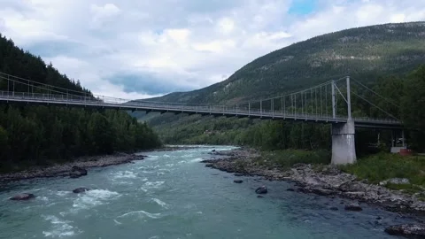 Aerial Drone view of Sjoa River bridge in Norway near stunning mountains Stock-Footage 301319910