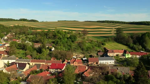 Aerial drone view of a small Czech village with terracotta rooftops bordered by Stock Footage 336616642