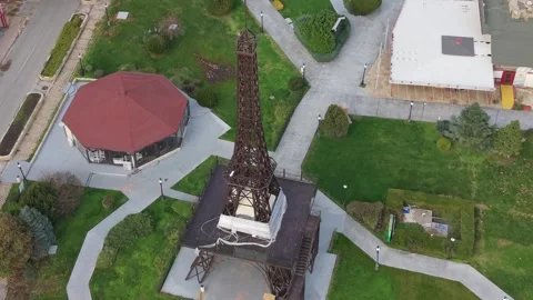 Aerial drone view of small Eiffel Tower replica in park Stock Footage 322538111