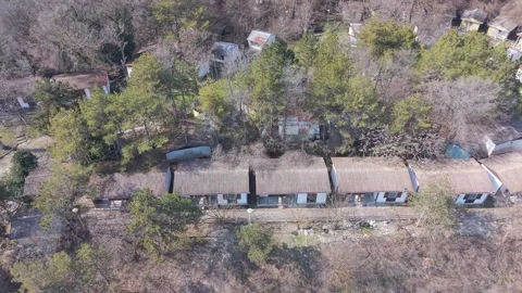 Aerial Drone View Of Small Rural Village Surrounded By Trees Vídeo Stock 330288889