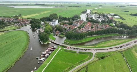 Aerial drone view of a small settlement village in Friesland, the Netherlands. 스톡 동영상 249091741
