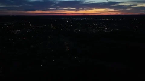 Aerial Drone View of Small Town Traffic and City Lights at Dusk Stock Footage 341625565