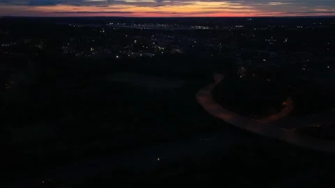 Aerial Drone View of Small Town Roads and Traffic at Dusk Stock Footage 341625566