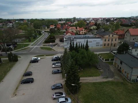 Aerial Drone View of Small Town Residential Area with Houses, Roads and Greenery Stock Photos