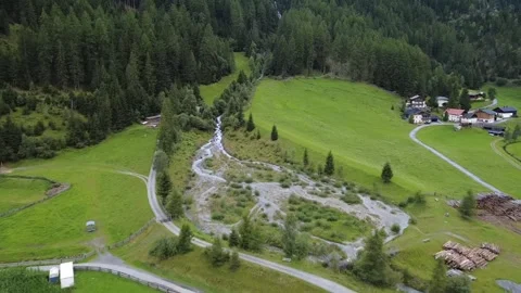 Aerial Drone View of a Small Warefall and Mountain Stream in Huben, Austria 動画素材 338001445