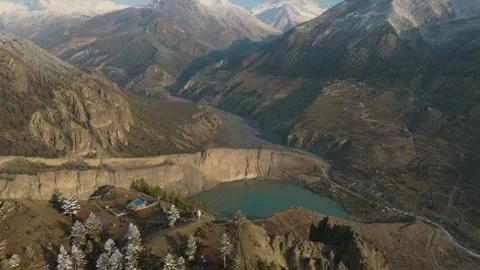 Aerial drone view of the snow-capped giants surrounding the pristine Gangapurna Stock Footage 311019050