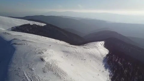 Aerial Drone View of Snow-Covered Mountain Ridge and Scenic Winter Landscape Stock Footage 324632829
