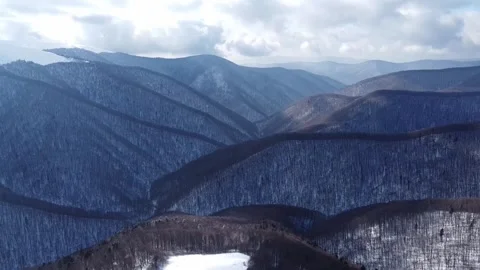 Aerial Drone View of Snow-Covered Mountain Ridges in the Carpathians Stock Footage 327376028