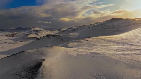Aerial drone view of snow-covered mountain landscape at sunrise Stock Footage 345034515