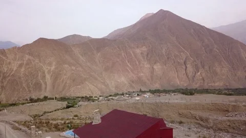 Aerial drone view soaring over a country house between mountains in the highland Stock Footage 199562863