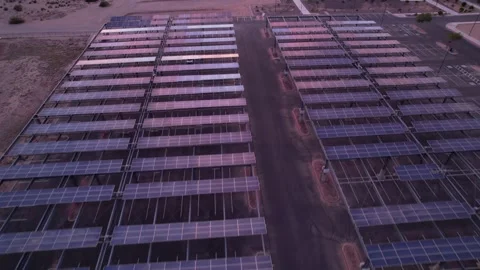 Aerial drone view of solar panel farm grid pattern at sunset Stock Footage 331380933