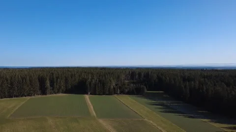 Aerial drone view of spring forest and fields in sunny countryside Germany Stock Footage 330268254
