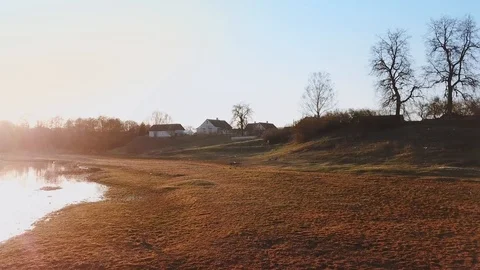 Aerial drone view: spring sunset over the village. Top view on beautiful Stock Footage 90133075