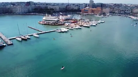 Aerial Drone View Stand Up Paddle Surfing in the waters off Bari, Apulia, Italy Stock Footage 150390238