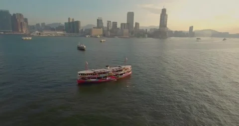 Aerial Drone View of Star Ferry Crossing Victoria Harbour in Hong Kong Stock Footage 136094409