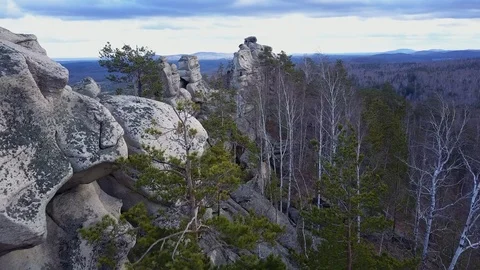 Aerial drone view; steep stone cliff; high mountaine range, Ural Stock Footage 108650650