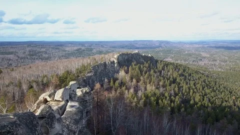 Aerial drone view; steep stone cliff; high mountaine range, Ural Stock Footage 108650784