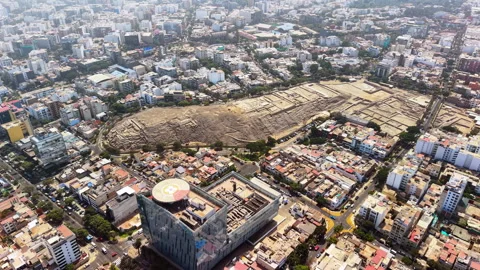 Aerial drone view of the stepped adobe walls of the Huaca Pucllana ruins inside Stock Footage 344971250