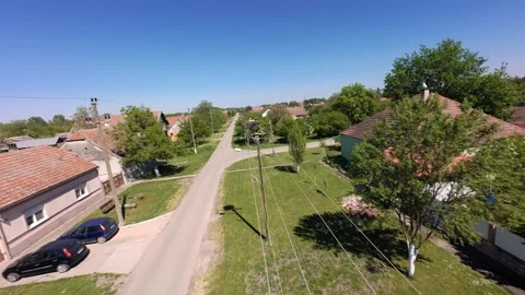 Aerial drone view of stork nests along a village street 스톡 동영상 334174128