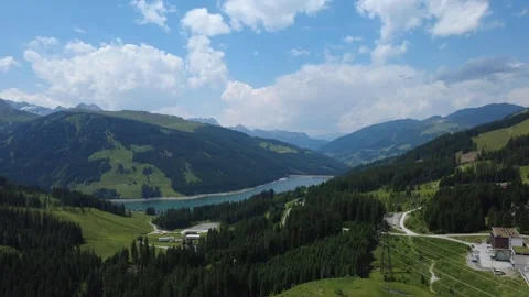 An Aerial Drone View of the Stunning Austrian Alps with a Beautiful Lake in.. Stock Footage 314842543