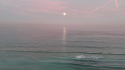 Aerial drone view of a stunning moon above the sea during early morning Stock Footage 298004976