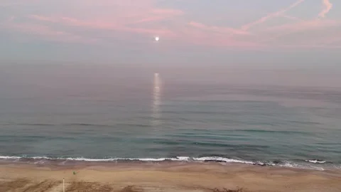 Aerial drone view of a stunning moon above the sea during early morning Stock Footage 298005042