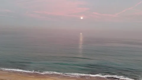 Aerial drone view of a stunning moon above the sea during early morning Stock Footage 298005055