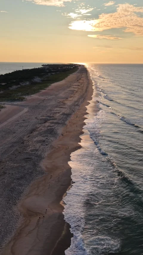 Aerial drone view of sunrise waves breaking along the shoreline Stock-Footage 345363603