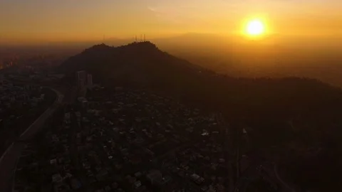 Aerial Drone view, sunset over Cerro San Cristobal hill, Santiago de Chile Stock Footage 100862473