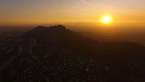 Aerial Drone view, sunset over Cerro San Cristobal hill, Santiago de Chile Stock Footage 100862487