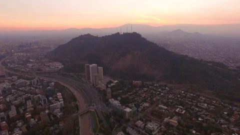 Aerial Drone view, sunset over Cerro San Cristobal hill, Santiago de Chile Stock Footage 100862787