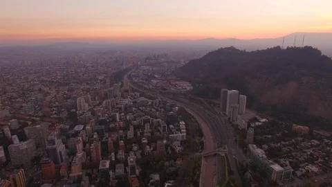 Aerial Drone view, sunset over Cerro San Cristobal hill, Santiago de Chile Stock Footage 100862833