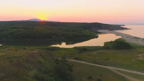 Aerial drone view of sunset over Veleka River estuary and Sinemorets Shore Stock Footage 134674312