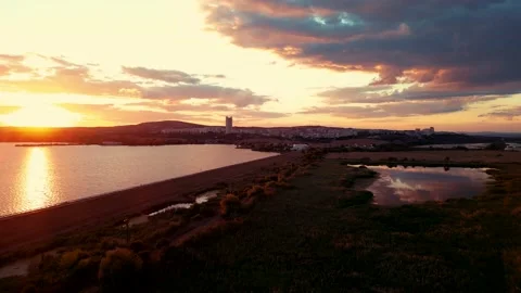 An aerial Drone view of sunset over Mandrensko lake,Burgas ,Bulgaria Stockbeeldmateriaal 230438525