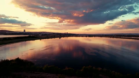 An aerial Drone view of sunset over Mandrensko lake,Burgas ,Bulgaria Stock Footage 230476857