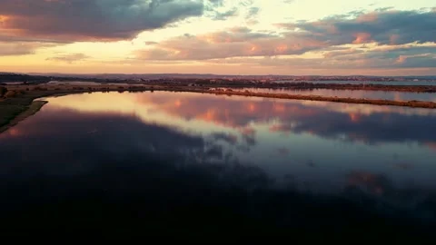 An aerial Drone view of sunset over Mandrensko lake,Burgas ,Bulgaria 스톡 동영상 230485041