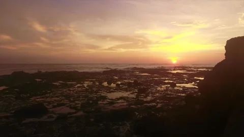 Aerial drone view of a sunset over a rocky beach in Costa Rica Video stock 319509450