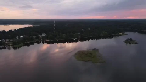 Aerial drone view of sunset over Lake Seliger Stock Footage 338096023