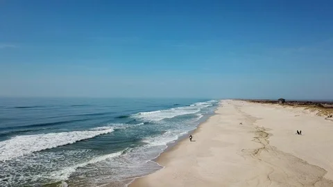 Aerial drone view of Surfer walking on Long Island Beach Видео 106043630