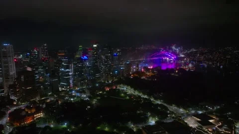 Aerial Drone View of Sydney at Night, Colourful Fireworks Exploding Over the Stock Footage 346132471