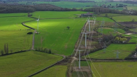 Aerial drone view of T-pylon training facility and power lines in Eakring UK 스톡 동영상 330958474