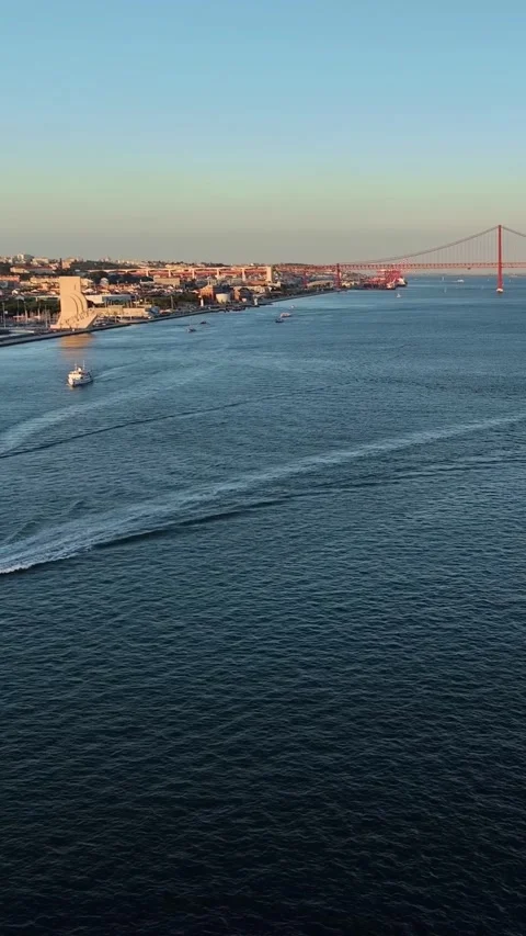 Aerial drone view of Tagus River with container ship at sunset. Lisbon, Portugal Stock-Footage 344584363