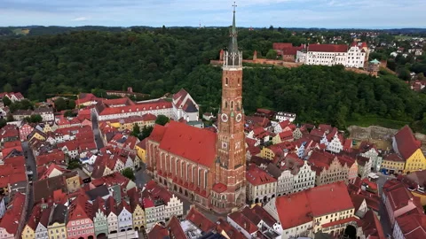 Aerial drone view of the tall brick tower of St Martin's Church rising over the Stock Footage 344929602