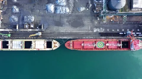 Aerial drone view of Terminal for cargo handling activities and cargo ships at Vidéo 332570782